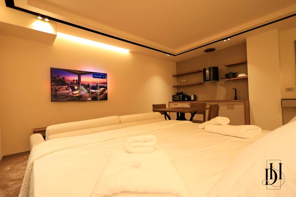 Postel nebo postele na pokoji v ubytování DeHa Rooms & Apartments