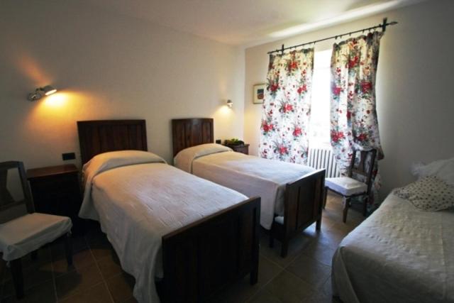 A bed or beds in a room at Gli Appartamenti Di Torre Bertona