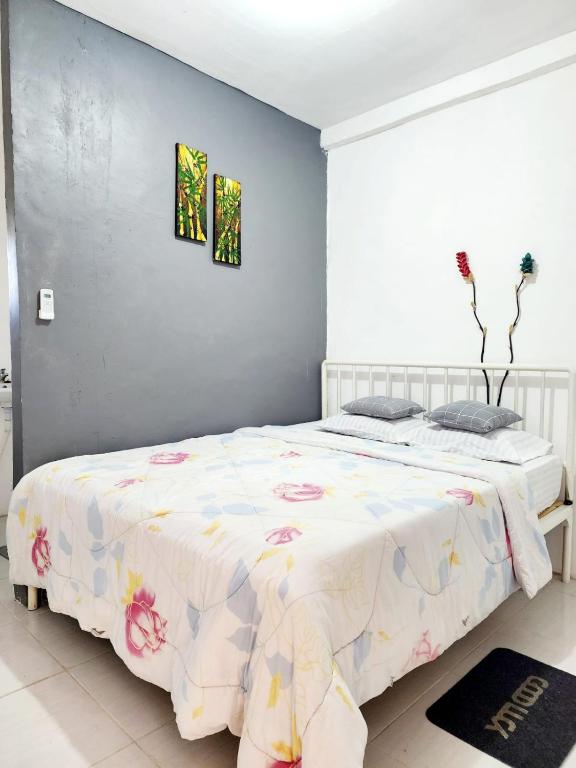 Postel nebo postele na pokoji v ubytování D'Flora Homestay