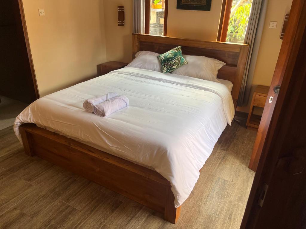 Postel nebo postele na pokoji v ubytování Ananda House
