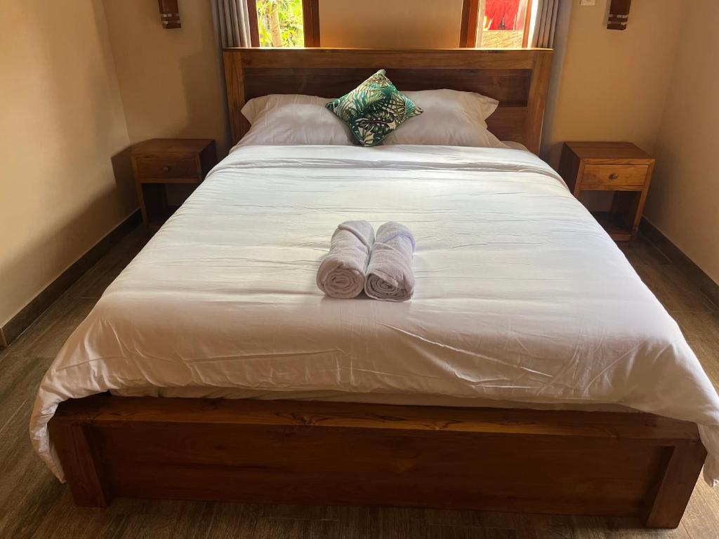 Postel nebo postele na pokoji v ubytování Ananda House