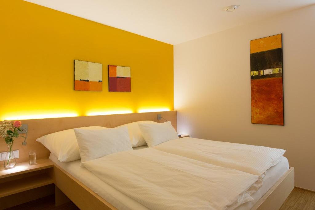 Postel nebo postele na pokoji v ubytování Alpenappartement Bergkönig