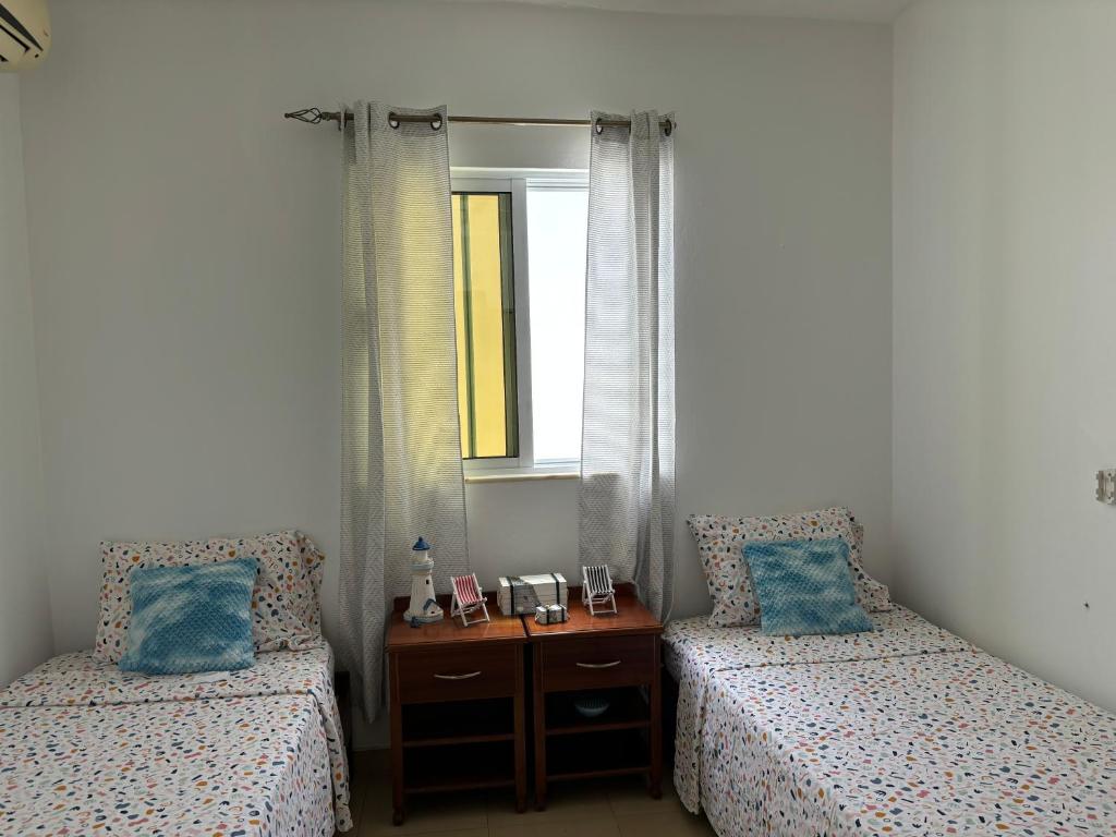 Postel nebo postele na pokoji v ubytování City Center Near Beach B&B