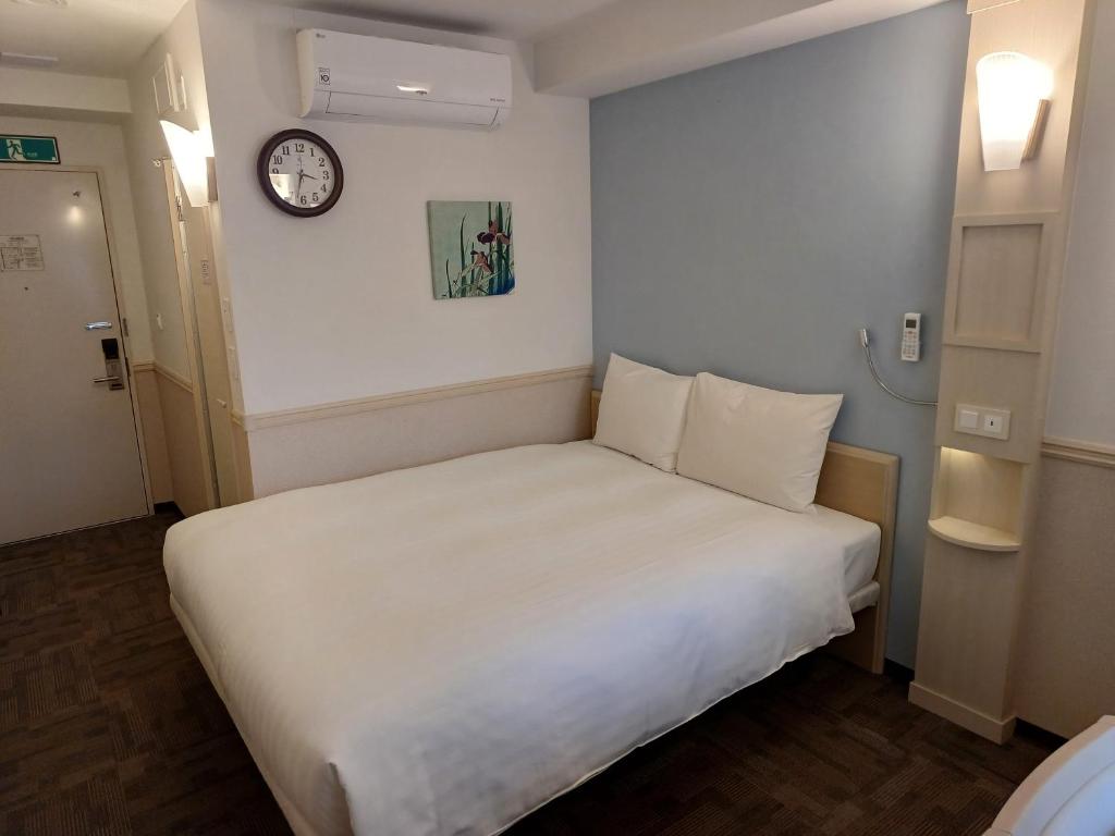 Postel nebo postele na pokoji v ubytování Toyoko Inn Ulsan Samsan