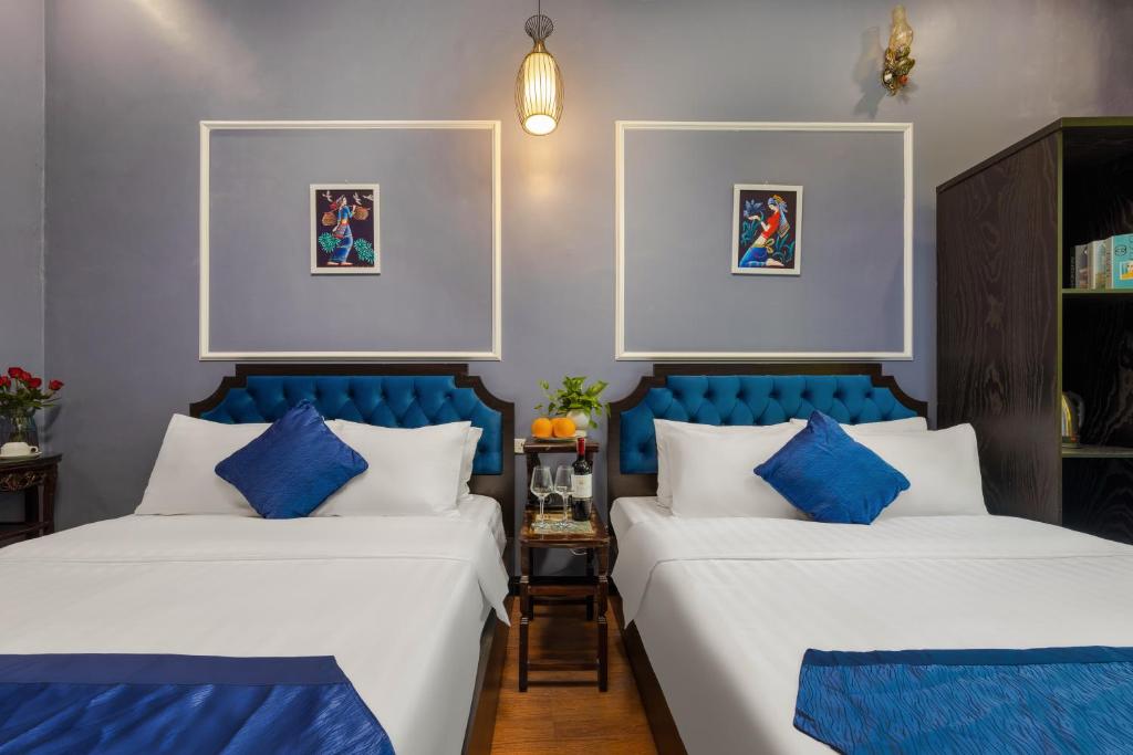 Postel nebo postele na pokoji v ubytování Amanda Boutique Hotel & Travel