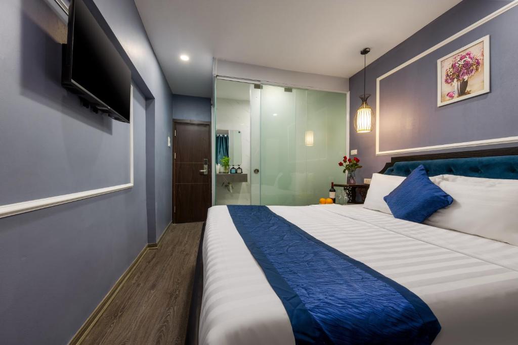 Postel nebo postele na pokoji v ubytování Amanda Boutique Hotel & Travel