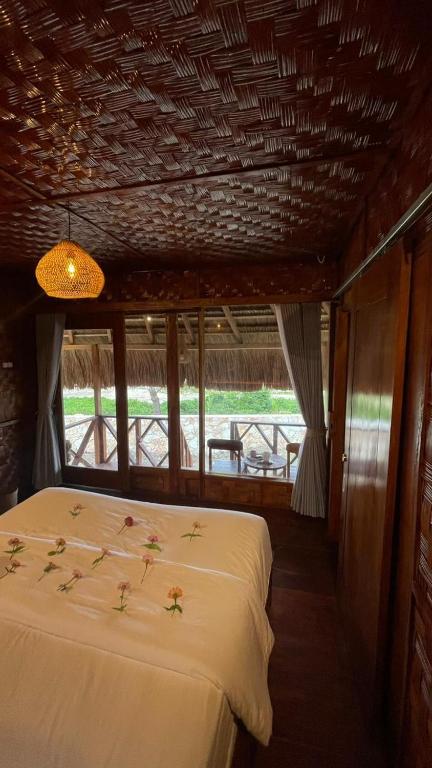 Postel nebo postele na pokoji v ubytování Three Queen Villa and Homestay