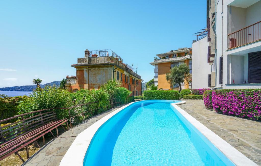 a swimming pool in the middle of a building at 2 Bedroom Awesome Apartment In Rapallo in Rapallo