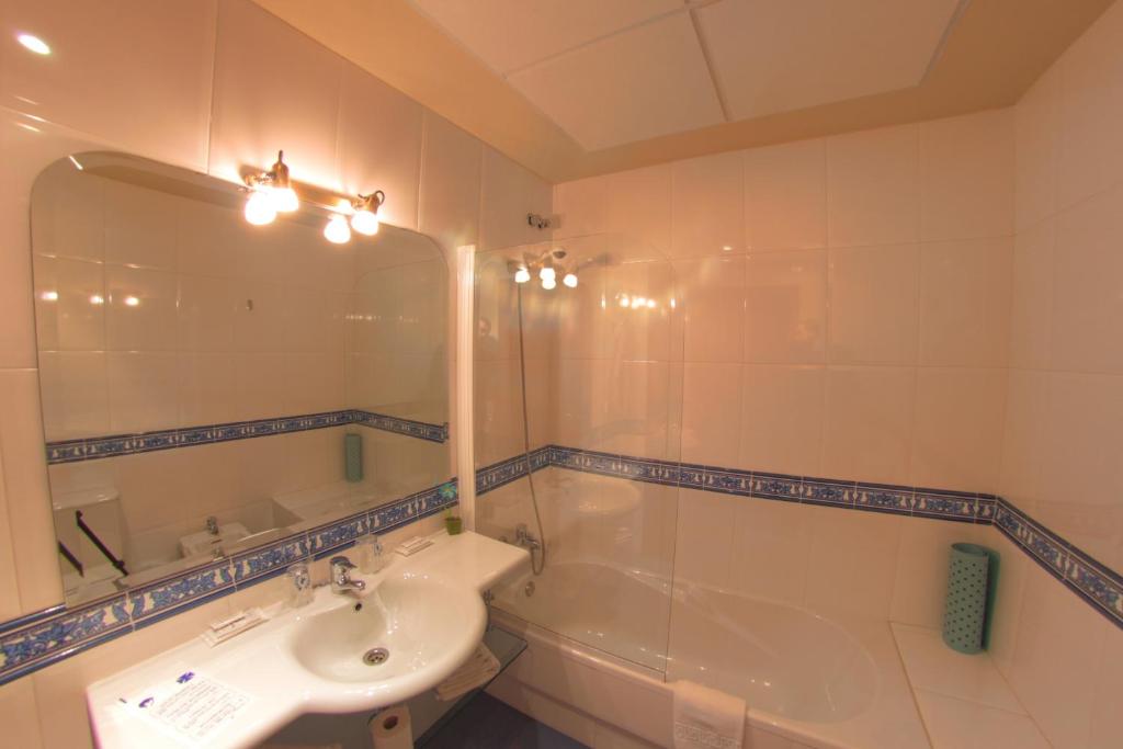 Koupelna v ubytování Hotel Avenida