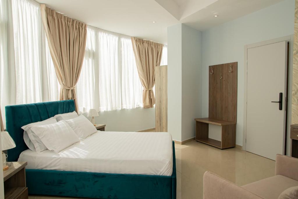Postel nebo postele na pokoji v ubytování Alv Rent Rooms