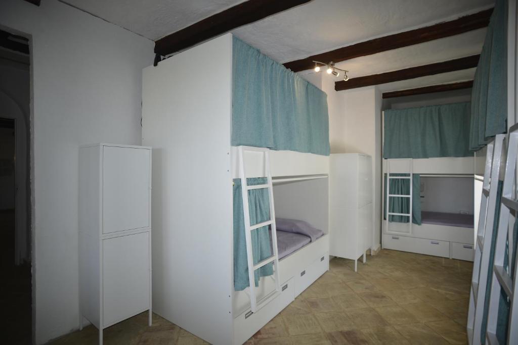 Postel nebo postele na pokoji v ubytování Kite Hostel Stagnone