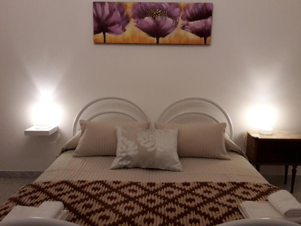 Postel nebo postele na pokoji v ubytování B&B Dimora Lucia e Dalila