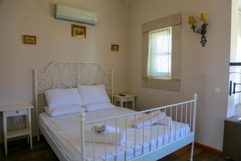 Postel nebo postele na pokoji v ubytování Rikas Boutique Otel