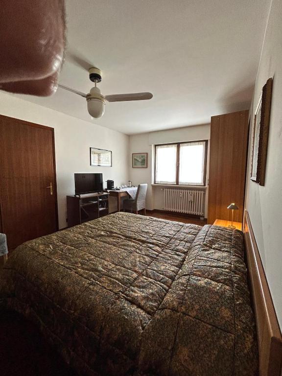 Postel nebo postele na pokoji v ubytování Mansarda di Charme a Verona