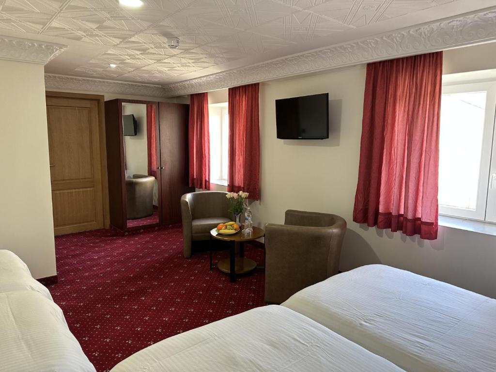 TV a/nebo společenská místnost v ubytování Hotel Eikenhof