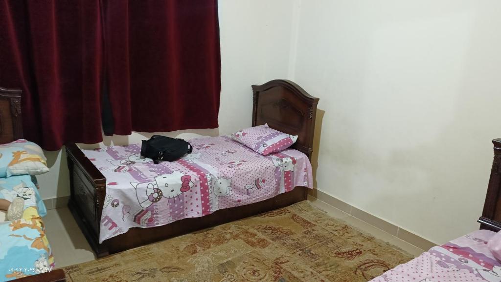 Postel nebo postele na pokoji v ubytování Mousa coast Resort شالية كامل للايجار موسي كوست
