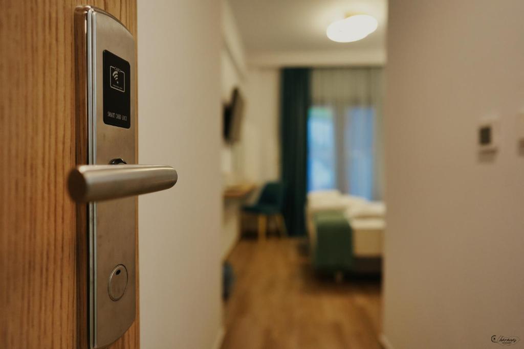 Postel nebo postele na pokoji v ubytování Electra Suites