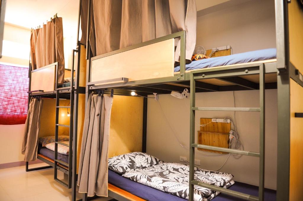 Postel nebo postele na pokoji v ubytování Taitung Ohana Sky Hostel