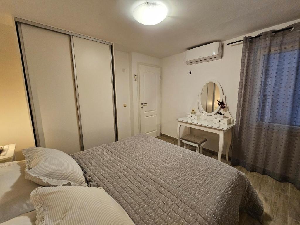 Posteľ alebo postele v izbe v ubytovaní Apartman Muracca
