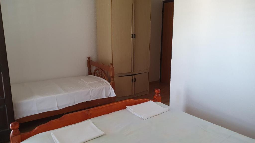 Postel nebo postele na pokoji v ubytování Guesthouse Sinani