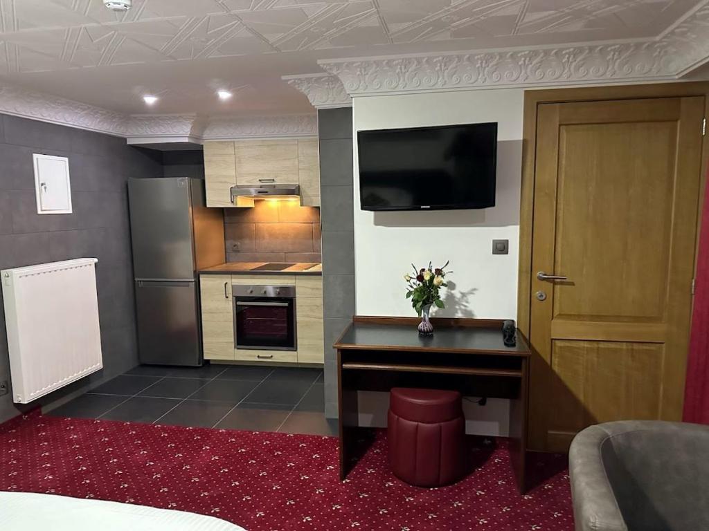 Kuchyň nebo kuchyňský kout v ubytování Hotel Eikenhof