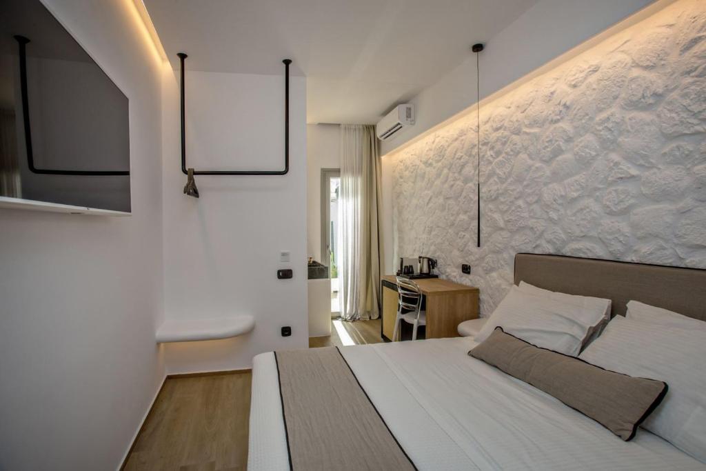 Ένα ή περισσότερα κρεβάτια σε δωμάτιο στο Levantes Luxury Suites I