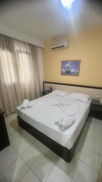 Postel nebo postele na pokoji v ubytování Sunrise Hotel Cameria