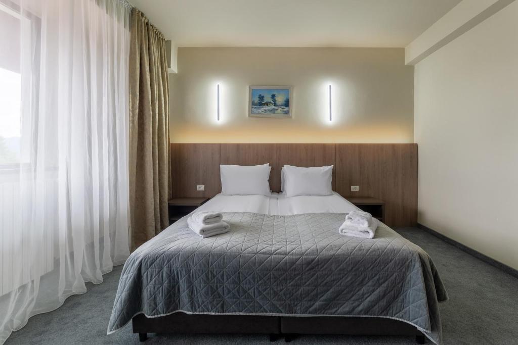 Postel nebo postele na pokoji v ubytování Hotel Hera