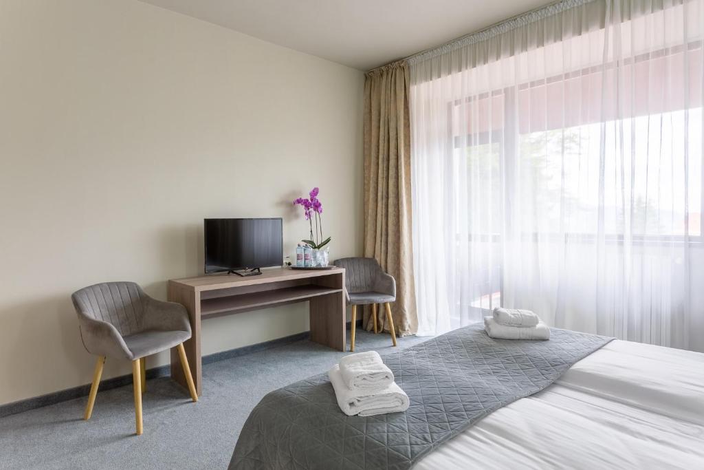 Postel nebo postele na pokoji v ubytování Hotel Hera
