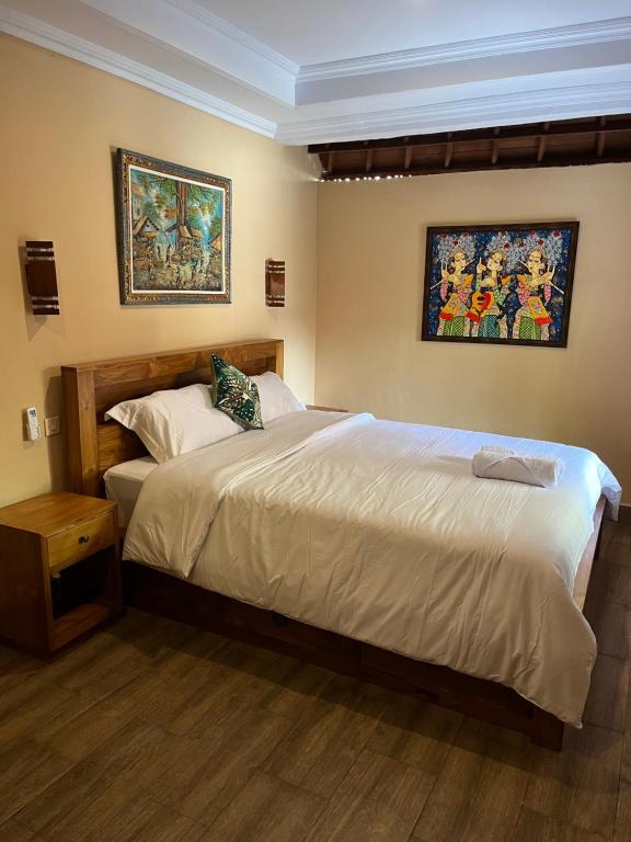 Postel nebo postele na pokoji v ubytování Ananda House