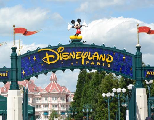 a disneyland park sign with a mickey mouse on it at Disneyland Family and Friends great location apart in Chessy