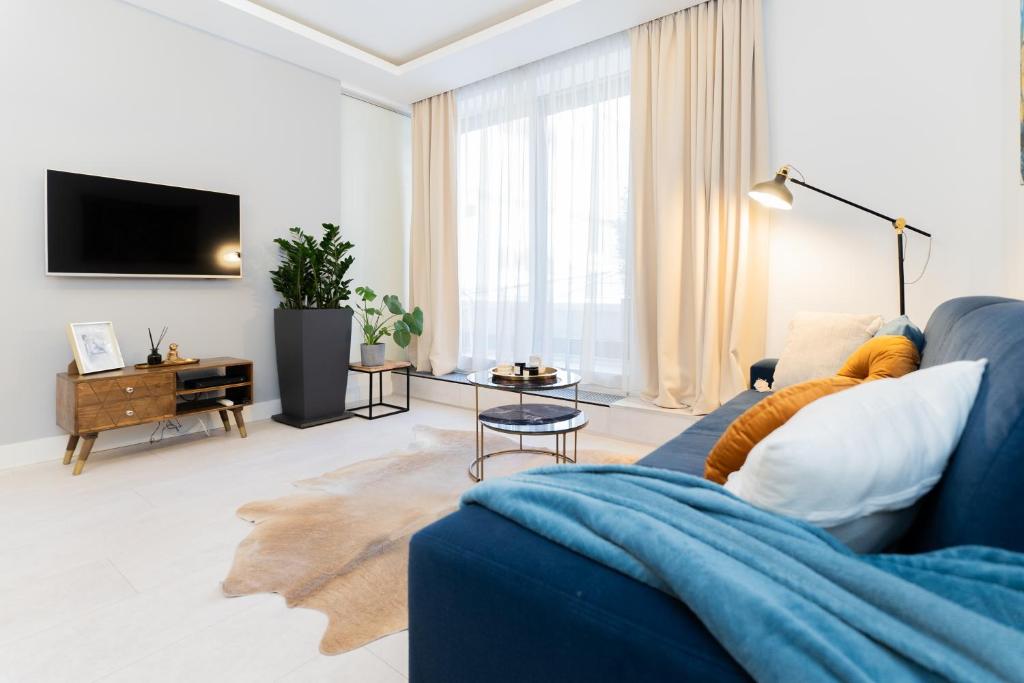 Televízia a/alebo spoločenská miestnosť v ubytovaní PLATER PREMIUM APARTMENTS