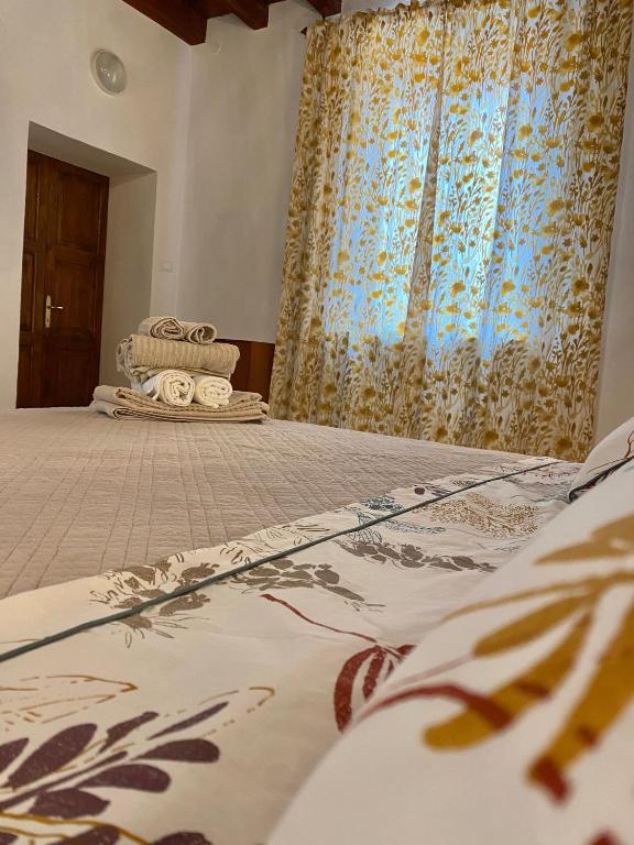 Postel nebo postele na pokoji v ubytování Nel Cuore di Volta Mantovana