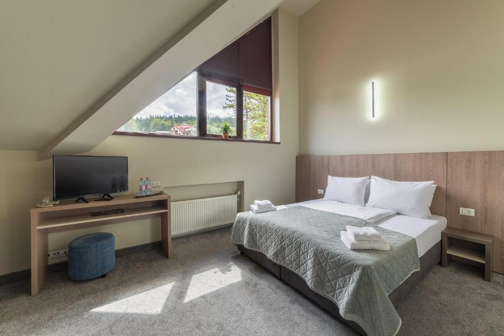 Postel nebo postele na pokoji v ubytování Hotel Hera
