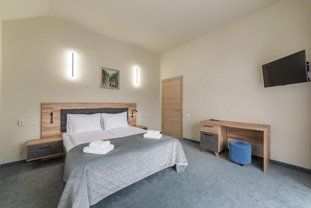 Postel nebo postele na pokoji v ubytování Hotel Hera