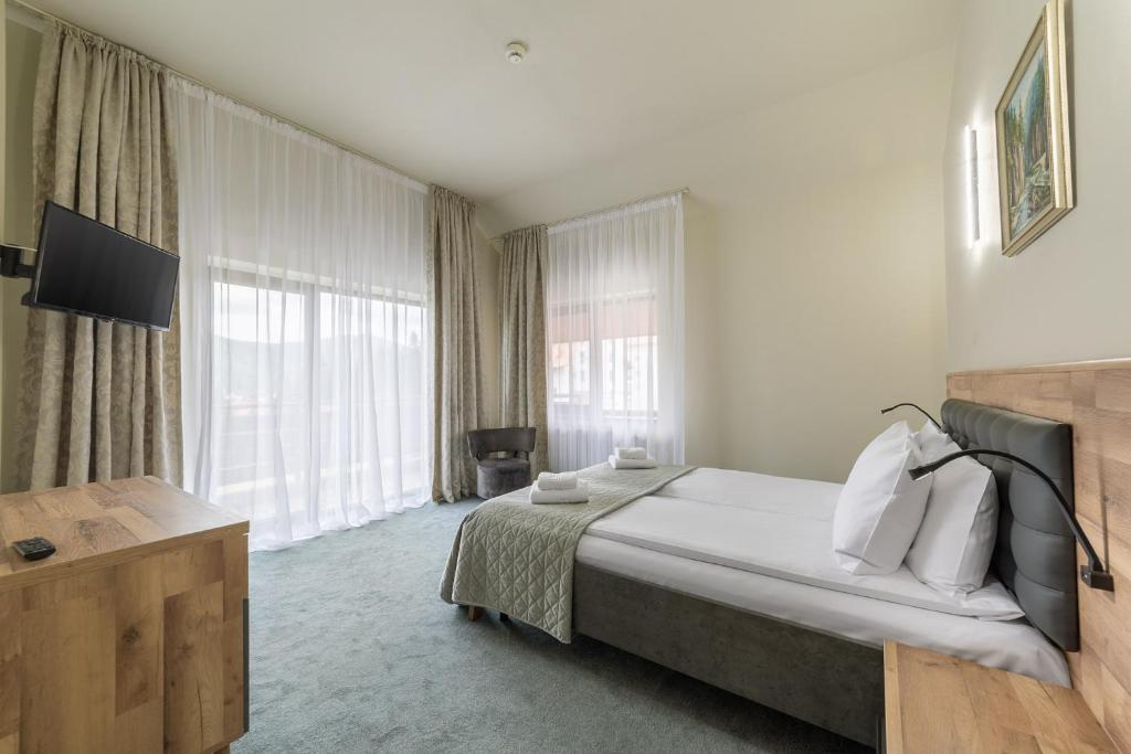 Postel nebo postele na pokoji v ubytování Hotel Hera