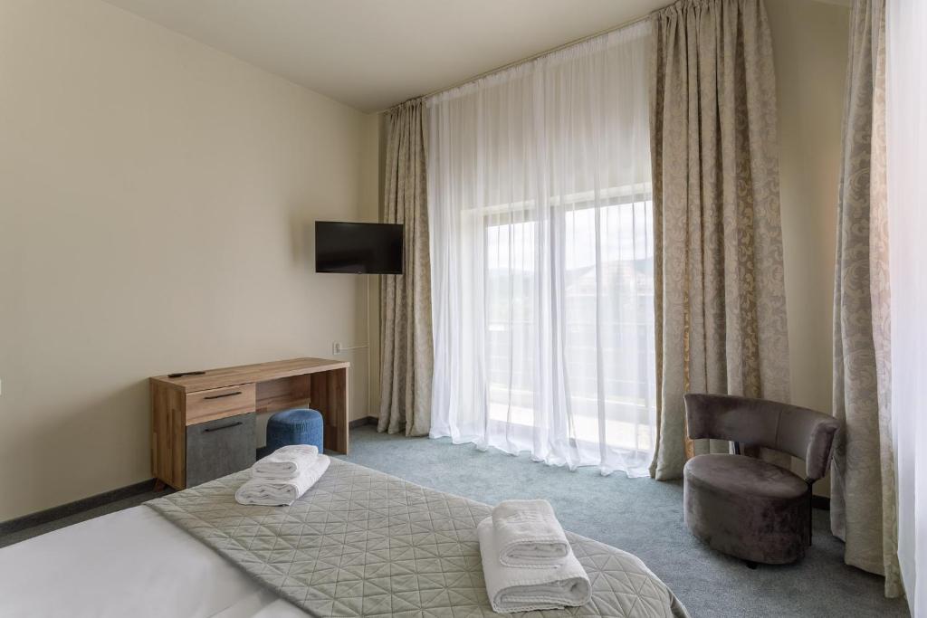 Postel nebo postele na pokoji v ubytování Hotel Hera