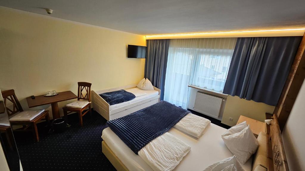 Postel nebo postele na pokoji v ubytování Panoramahotel