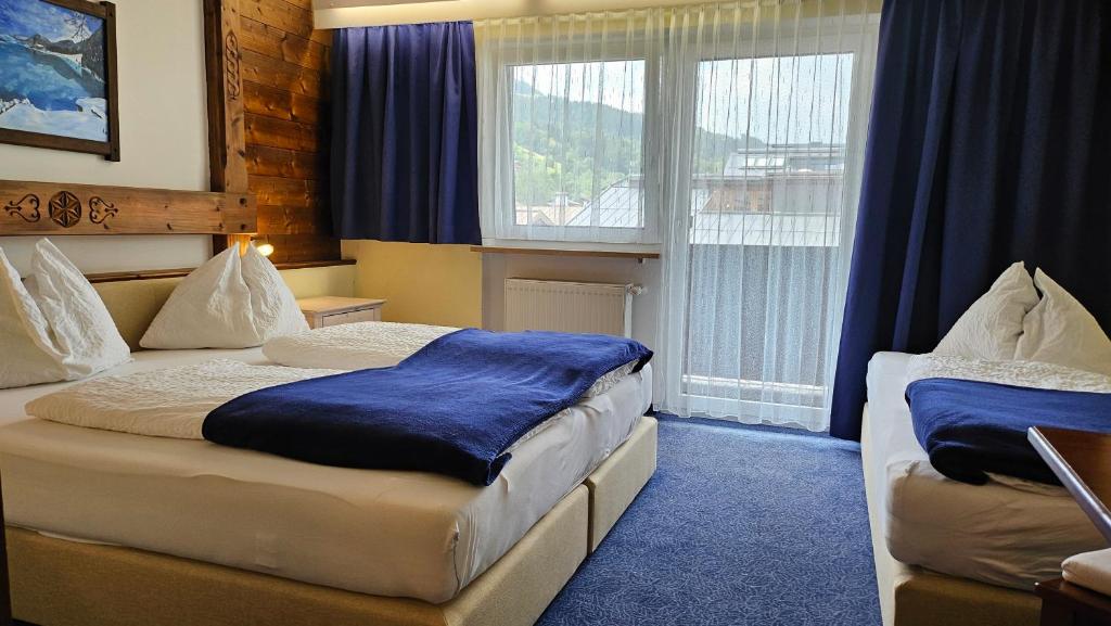 Postel nebo postele na pokoji v ubytování Panoramahotel