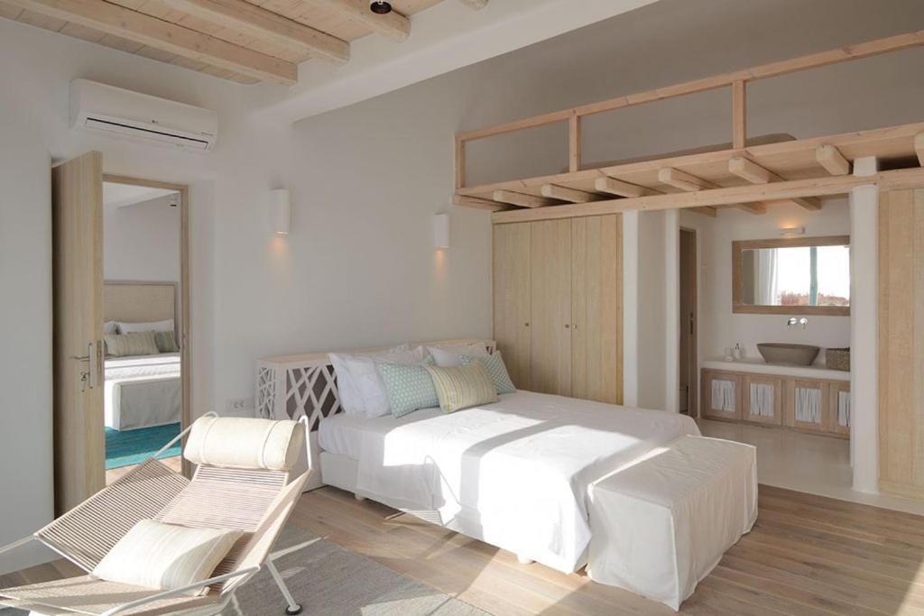 Postel nebo postele na pokoji v ubytování Bluebird Villas Villa Sunbird