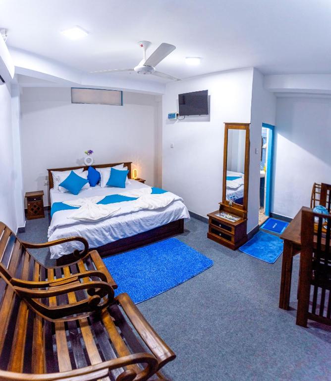 Postel nebo postele na pokoji v ubytování JayS Place Matale