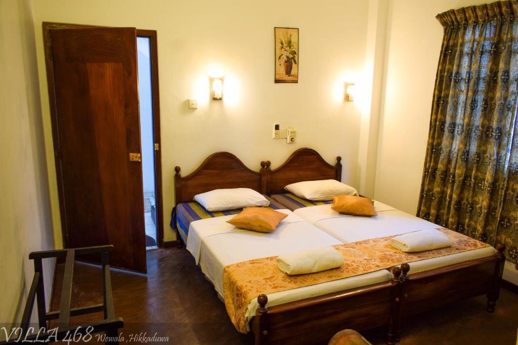 Postel nebo postele na pokoji v ubytování Villa 468 - Hikkaduwa
