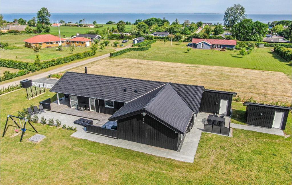 an overhead view of a house with a large yard at Four-Bedroom Holiday Home In Nordborg in Nordborg