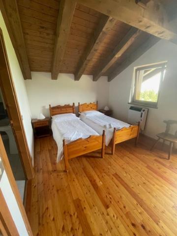 Postel nebo postele na pokoji v ubytování Rifugio Monte Pura