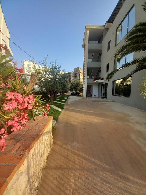 an empty street in front of a building at Hotel Ksamili in Ksamil