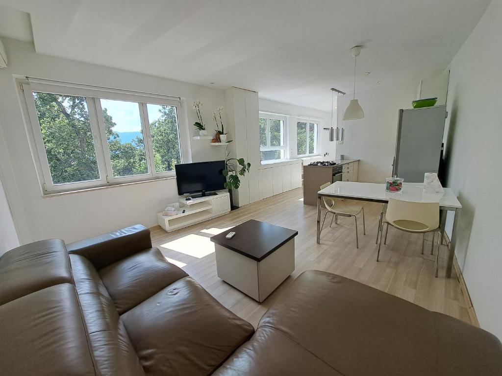 a living room with a couch and a table at NoAr Apartment Rijeka in Rijeka