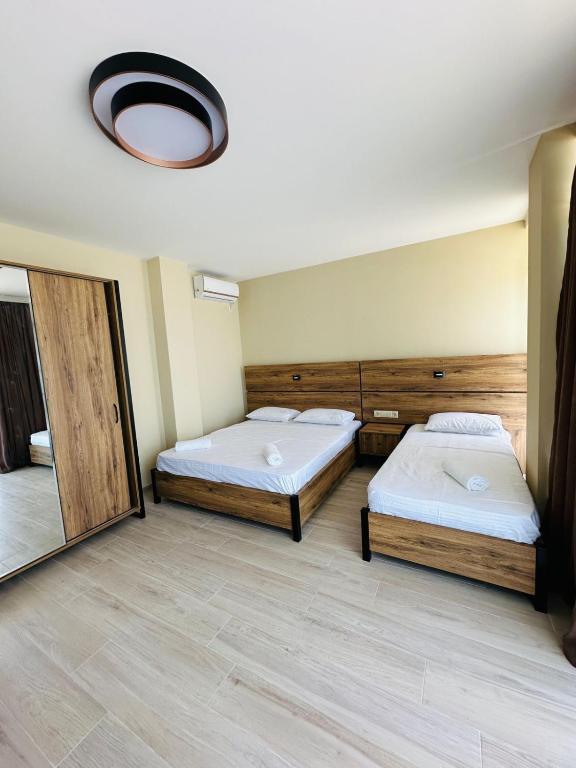 Postel nebo postele na pokoji v ubytování Paradise Shekvetili