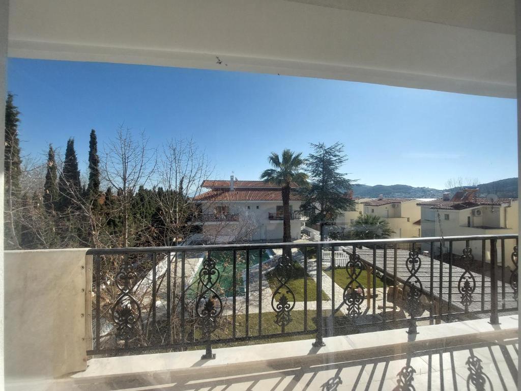 a balcony with a view of a city at Blue Bay Hotel in Iraklitsa