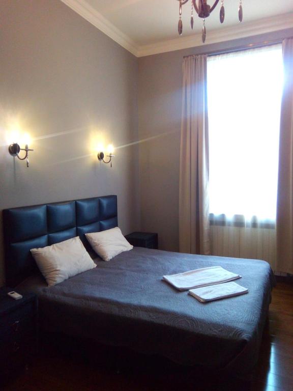Postel nebo postele na pokoji v ubytování Orbeliani Guesthouse