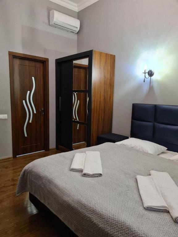 Postel nebo postele na pokoji v ubytování Orbeliani Guesthouse